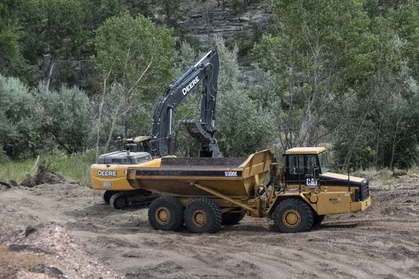 Tractor moving dirt