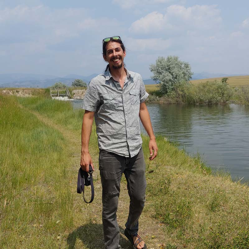 Man standing by canal