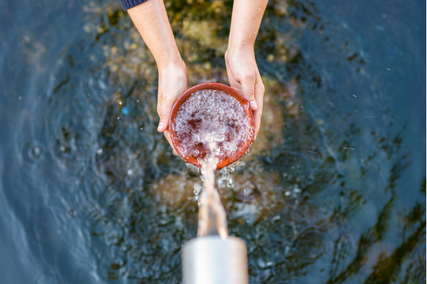 Water flowing into a container.